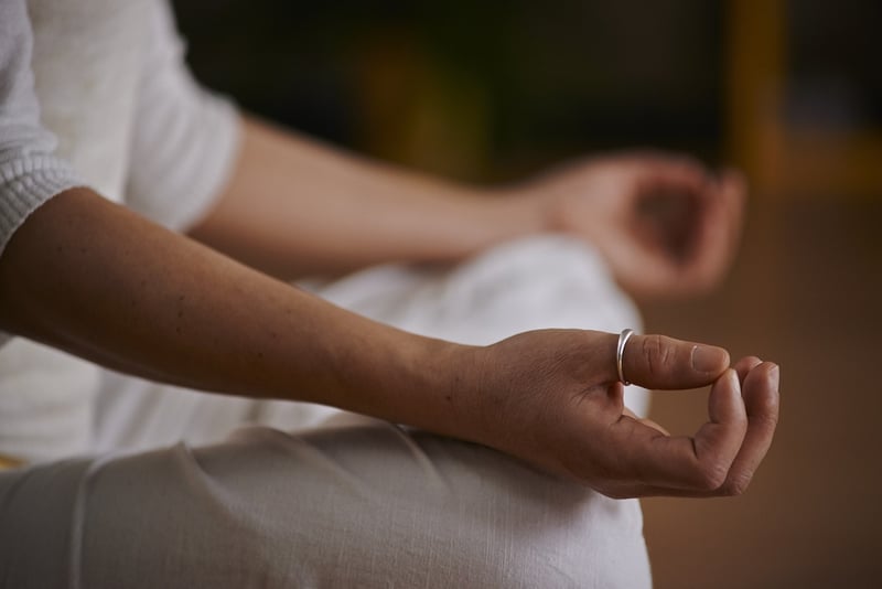 Woman practicing yoga and meditation